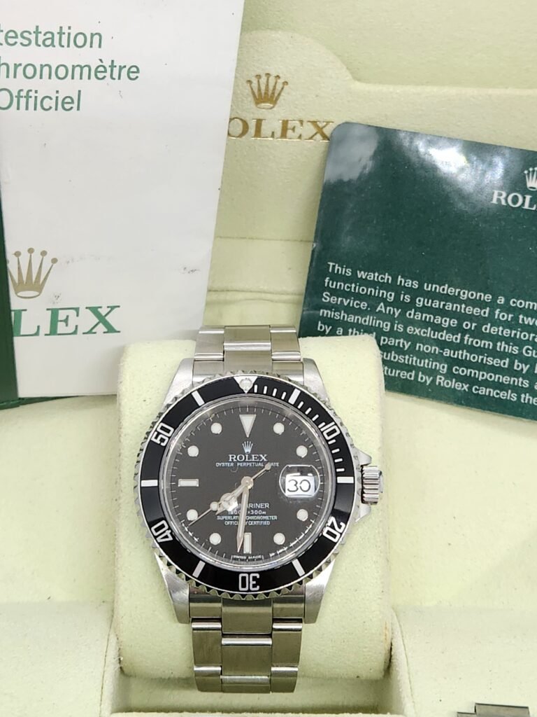Rolex Modelo submariner Referencia 16610 Año 2007 Caja y documentación Tambien incluye tarjeta de revisión rolex hecha en 2022 Tamaño 40mm Bisel de aluminio Brazalete completo tenerife breitling omega te quiero watches